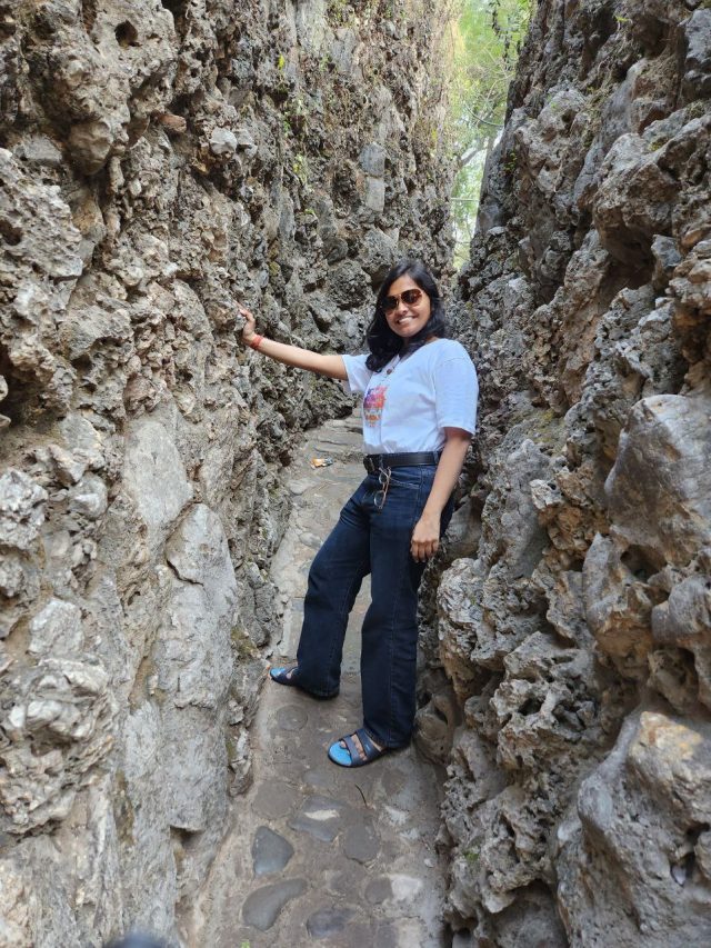 Standing between rocks in rock garden chandigarh